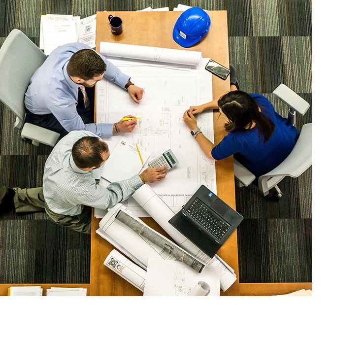 Contractors discussing work at desk